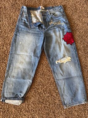 Women’s Distressed Blue Jeans with Red Rose Patch